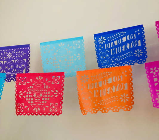 How To Set Up An Ofrenda Altar with traditional Día de Muertos altar supplies and papel picado decorations
