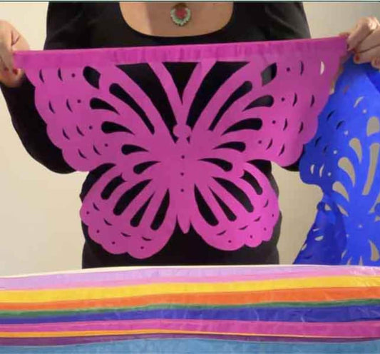Pink butterfly papel picado with stacked colorful garlands for Día de los Muertos – Fiesta Fancies