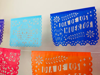 Blue, orange and pink Día de los Muertos papel picado banner